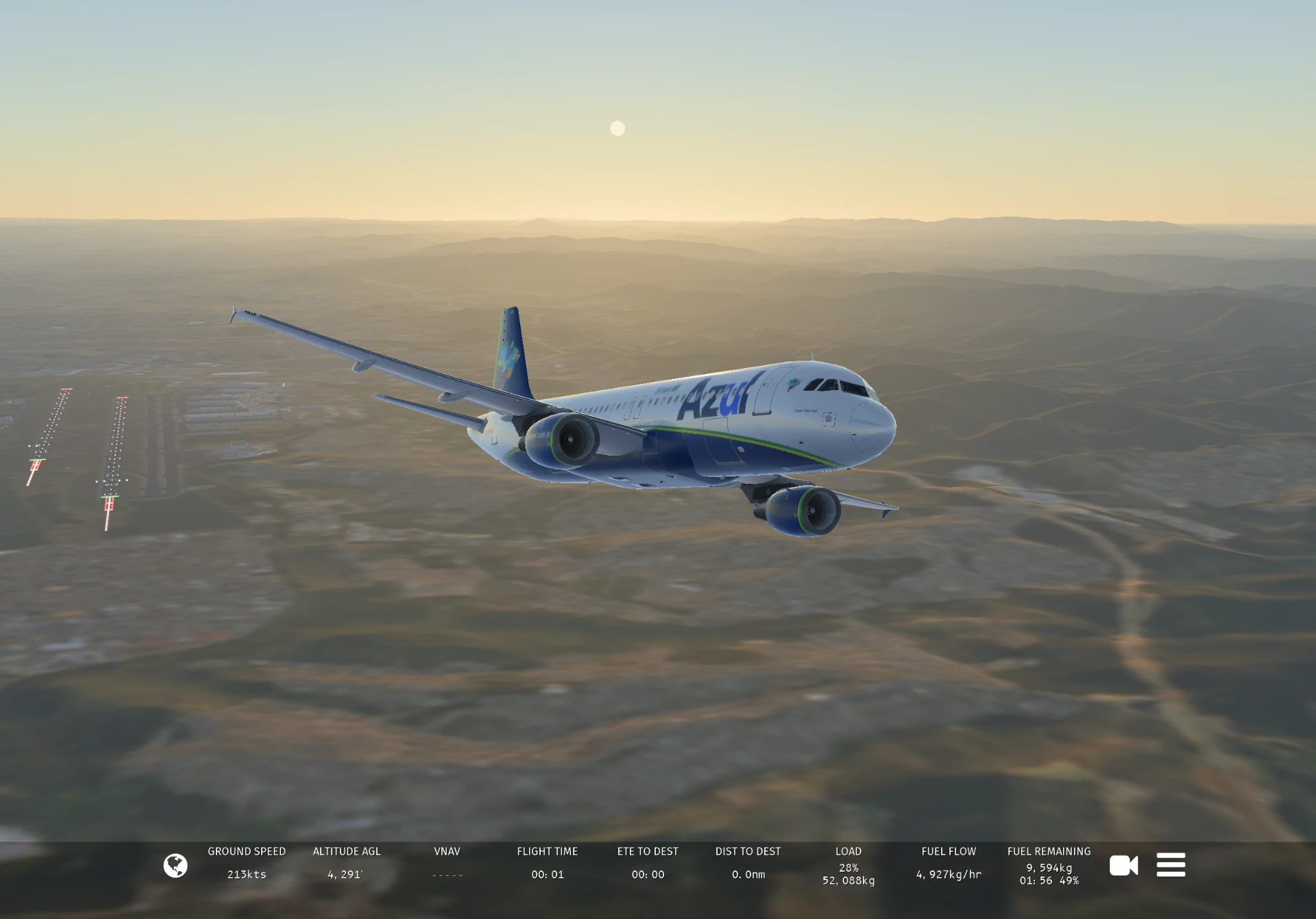 Azul aircraft cruising above the mountains at sunset